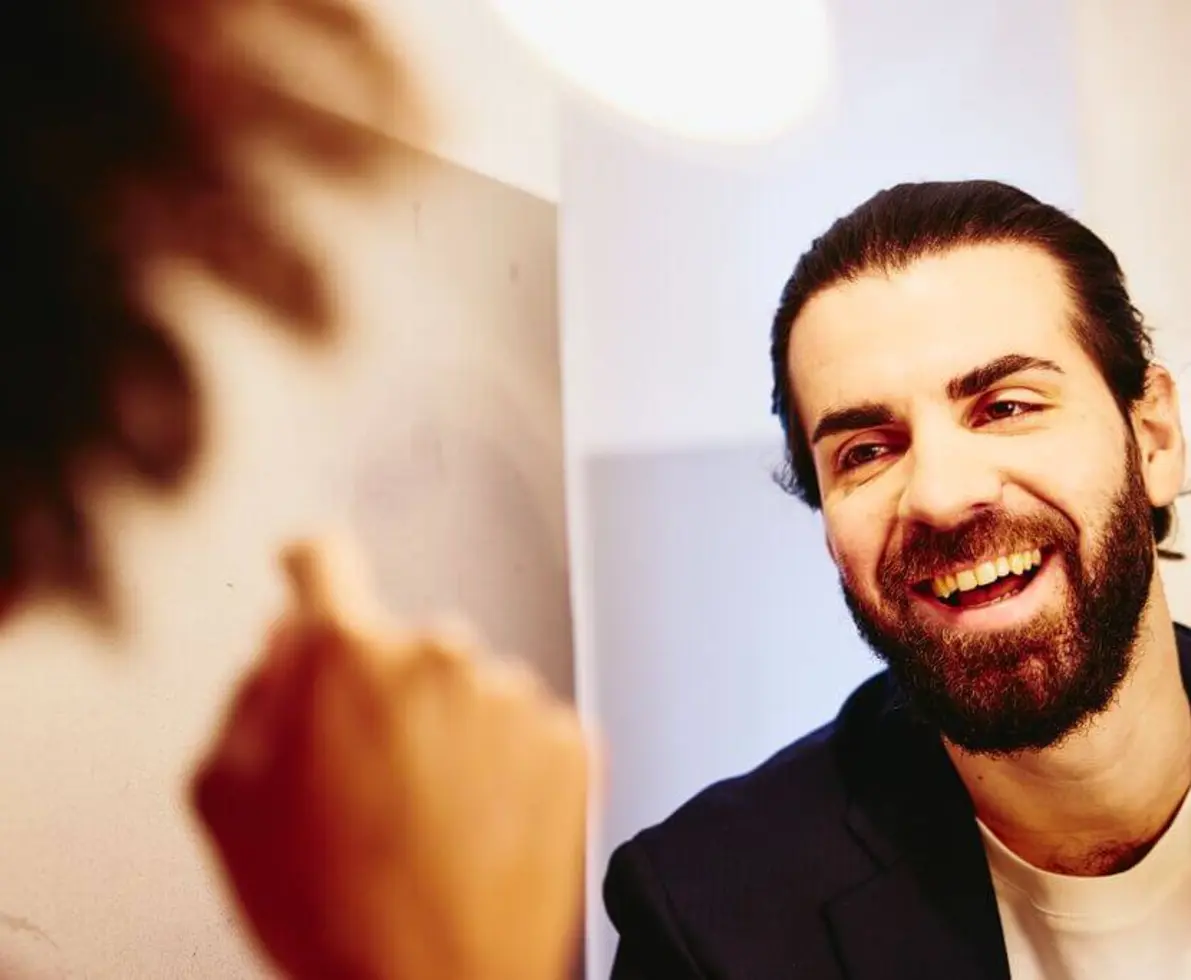 Close up - Smiling man looking at someone.