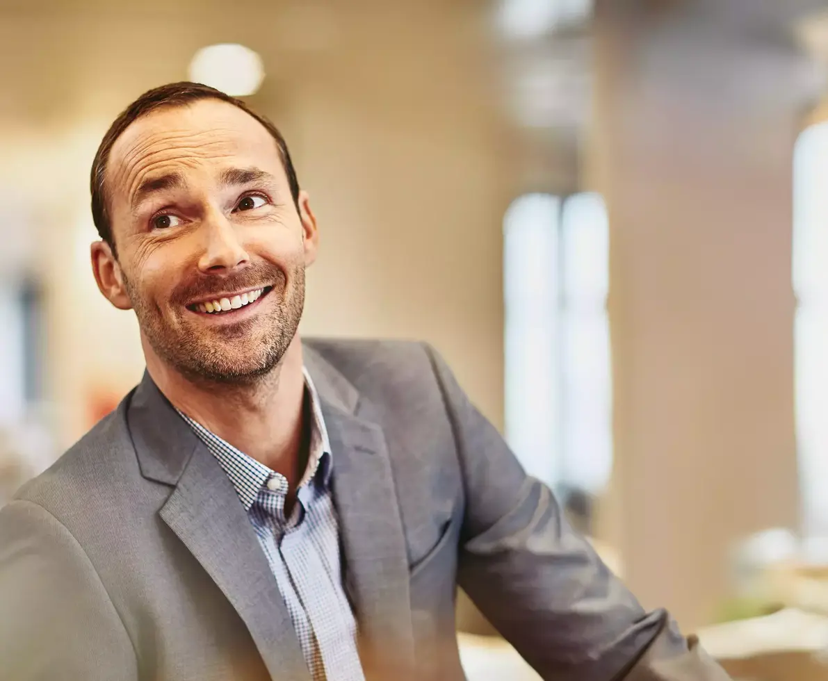 Male looking up in an office
