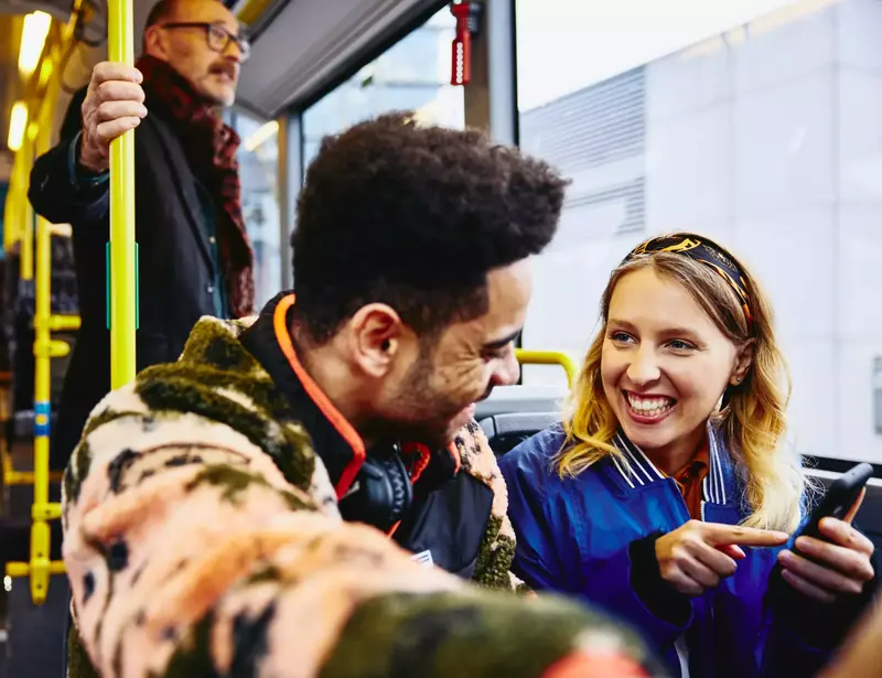 girl and boy having a conversation in a bus